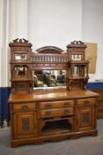 A large Victorian mirror back sideboard, the raised mirror back with central stipple carved arch