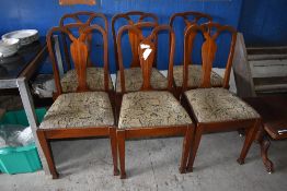 A set of six Edwardian mahogany dining chairs, having square section uprights and central vase