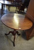 A George III mahogany snap top stem table, raised on a balluster turned stem and three downswept