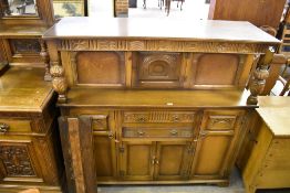 A 20th century reproduction oak court cupboard. 138CM
