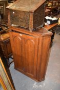 A 19th Century oak corner cupboard the single door with double arched panels. 110CM.