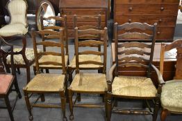 A set of four 19th century style rush seated ladderback chairs, sold together with a 20th century