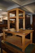 A modern light oak rectangular coffee table with under shelf and sold together with a near