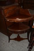 A George III Mahogany two tier corner washstand. 94CM.