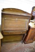 An early 20th century oak 'The Lebus Bookcase' bureau, the upper stage of traditional design over
