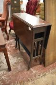 An Edwardian Art and Crafts oak Sutherland table, 78CM. X 76CM.
