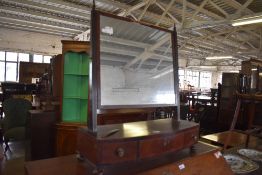 A 19th century mahigany swing dressing mirror. 76CM. Some veneer losses.