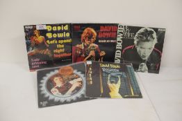 A David Bowie lot of five European picture sleeves and in photo