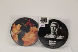 A lot of two pictures discs - ' Breaking Glass ' live ep and ' China Girl ' David Bowie