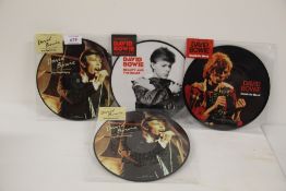A lot of four David Bowie 40th Anniversary pic discs - mint copies 'boys keep swinging ' (2) ' knock