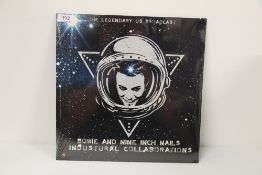 A David Bowie vinyl album - sealed with Nine Inch Nails - 11/10/1995