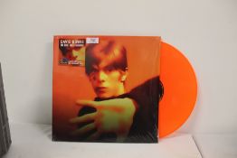 A David Bowie ' in the beginning ' orange vinyl limited edition in shrink but opened