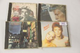 A David Bowie lot of four compact discs - the super rare early RCA pressings - would benefit from