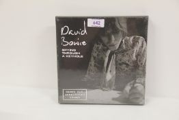 A David Bowie ' Spying through the keyhole ' limited four x 7' box set - sealed and mint
