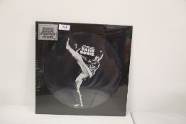 A David Bowie ' MWSTW ' pic disc issue - rare with poster and sealed