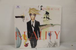 A David Bowie 'Reality ' while and blue splatter vinyl - getting rare this issue - NM