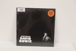 A David Bowie ' Amsterdam ' sealed orange vinyl 7' - rare now and getting hard to find - mint