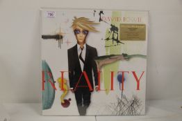 A David Bowie 'Reality ' -MOV issue on green vinyl with 12 page book sealed - mint