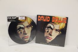 A lot of two David Bowie ' Silly Boy Blue ' 45's both sealed and one is a pic disc