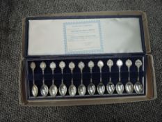 A set of 12 John Pinches Silver Zodiac Spoons, with certificate in case and outer card box
