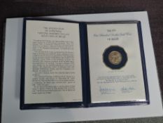 A Franklin Mint 1979 100 Dollar Gold Christmas Coin of Belize, weight 6.21g 500/1000 fine gold in