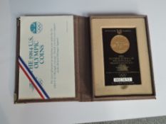 A 1984 United States Olympic 10 Dollar 900 Fine Gold Proof Coin, in case with certificate