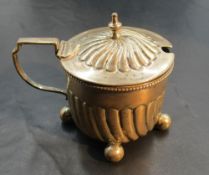A Victorian silver mustard, of circular form with spiral gadrooning to the domed cover and body,