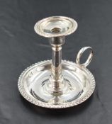 A late Victorian silver miniature chamber stick, of traditional design with gadrooned edge