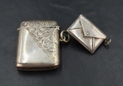 A George V silver vesta case of traditional form with half engraved scrolling decoration, marks