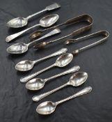 A selection of mixed silver spoons and sugar tongs, varying styles, dates and makers, gross weight