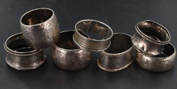A group of seven mixed silver napkin rings, of varying size, design age and maker, gross weight