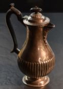 An Edwardian silver hotwater pot, of baluster form with domed finial topped cover over shallow