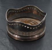 A silver plated wine coaster, of traditional form with turned oak interior, 12.5cm