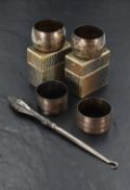 Two pairs of silver napkin rings including foliate engraved with monogrammed cartouche, Chester