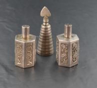 A near pair of Chinese silver coloured white metal pepperettes, having cylindrical pierced pull-