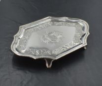A George III silver visiting card tray, of shaped rectangular outline, the moulded rim enclosing a