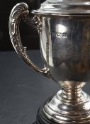 A George V silver trophy, of typical twin handled and lidded form with engraved inscription 'Suffolk