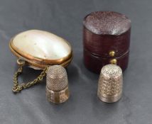 A late Victorian silver thimble, having traditional decoration, marks for Chester 1894, maker