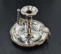 A Victorian silver chamber stick, of lobed circular form with bead moulded edge detail, having a