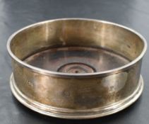 An Elizabeth II silver wine coaster, of circular form with moulded rims and stained and turned