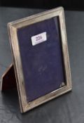 An imported silver mounted photograph frame, of rectangular form, with bead moulded and finely