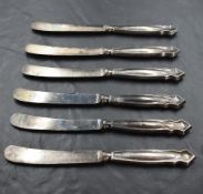 A set of six silver handled dessert knives having moulded handles, Sheffield 1917, Yates Brothers,