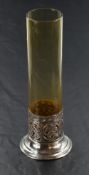 A silver and glass stem vase having cylindrical amber glass vase in a moulded silver base,
