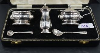 A 1960's cased silver three piece condiment set, of baluster form with re-entrant corners, marks for