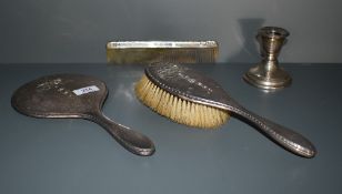 A George V silver mounted three piece brush set, comprising comprising hair brush, hand mirror and