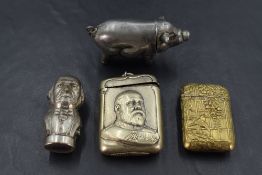 A group of four white and gilt metal vesta cases, to include a pig form vesta, Oriental design
