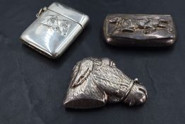 An unusual white metal 'ambiguous image' vesta case, in the form of a donkey's head, when tilted a
