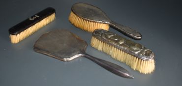 Three hallmarked silver dressing table items including Edwardian and Cherub pattern, and a wooden