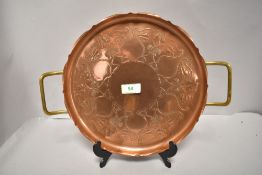 An Arts and Crafts era S&S Sankey copper tray with brass handles and foliage decoration