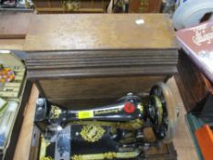 A Singer model F500384 oak cased sewing machine